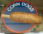 Girl Eating a Corndog: It's a corndog!